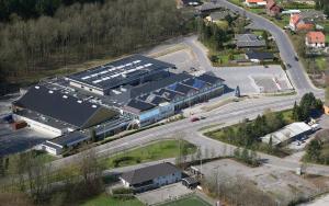 an overhead view of a large building with a road at Fyrtårn Tommerup Hostel in Tommerup