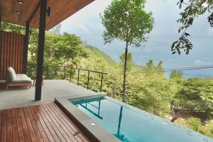 a view from the deck of a house with a swimming pool at Yume17 in Chaloklum