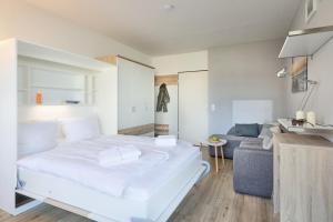 Ένα ή περισσότερα κρεβάτια σε δωμάτιο στο Frische Brise - 108 +12 φωτογραφίες