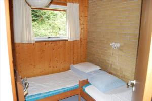 a small room with two beds and a window at SB50374-Aabenraa-Kloften-35 in Aabenraa