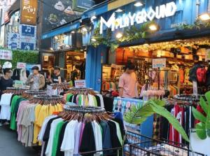 a store with a lot of clothes on display at Sol Stay Seoul Hongdae in Seoul