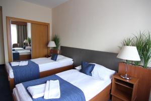 Ένα ή περισσότερα κρεβάτια σε δωμάτιο στο Hotel Theresia