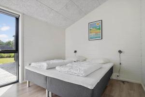 Postel nebo postele na pokoji v ubytování 20151-Samso-Solsortevej-18