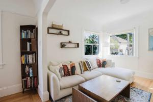 a living room with a couch and a table at Allura Oakland Your Private Sanctuary in the City in Oakland +29 photos