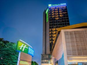 a building with a hospital sign in front of it at Holiday Inn Express Guiyang Downtown by IHG in Guiyang
