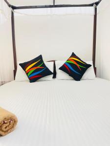Ένα ή περισσότερα κρεβάτια σε δωμάτιο στο Fish Tail Villa