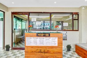 a restaurant with a sign in front of it at Super Collection O The Kailash Hotel in Dehradun