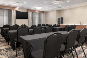 a conference room with black chairs and a podium at Homewood Suites By Hilton Wauwatosa Milwaukee in Wauwatosa +38 photos