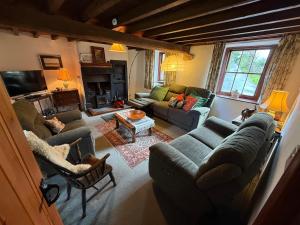 an overhead view of a living room with couches at Chapel Cottage in Cleator