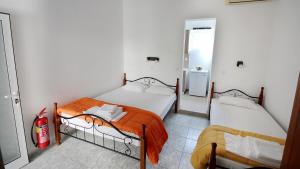 A bed or beds in a room at Ampelos apartment and studios