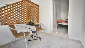 A bed or beds in a room at Ampelos apartment and studios