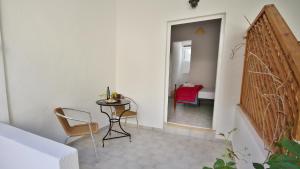 A bed or beds in a room at Ampelos apartment and studios