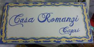 a sign for a csa emergency script on a cake at Casa Romanzi in Capri