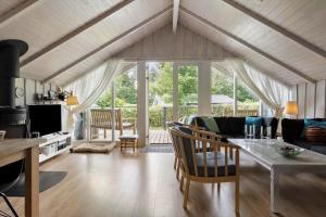 a living room with a couch and a table at SB106-Sydals-Harresbaek-16 in Sarup
