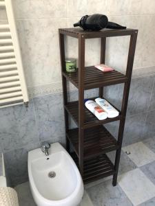 a bathroom with a toilet and a bidet at Santa Ana - Palacio Del Infantado in Seville +18 photos