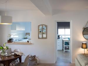 a living room with a table and a kitchen at Charming country house Torremolinos in Torremolinos +44 photos
