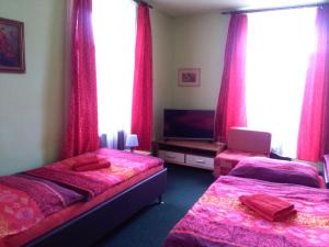 Postel nebo postele na pokoji v ubytování Guest House U Zámku