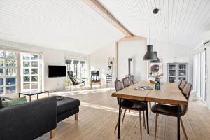 a living room with a table and a couch at TV1426-Skagen-Sostjernevej-1-B in Skagen