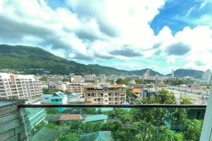 a view of a city from a balcony at EMERALD TERRACE CONDO 52-FAMILY 1 Bedroom POOL VIEW in Patong Beach