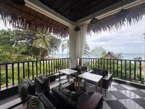 a living room with a view of the ocean at G Boutique Resort - Santander in Santander