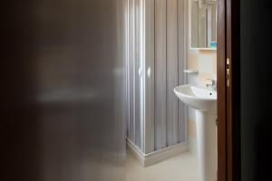 a bathroom with a shower and a sink at Licata Mare in Trapani