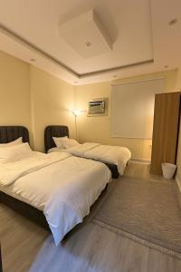 Ένα ή περισσότερα κρεβάτια σε δωμάτιο στο Apartment in Madinah +5 φωτογραφίες