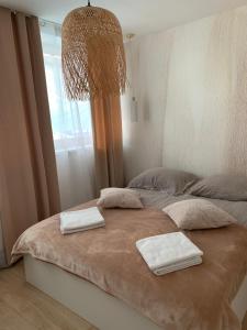 Ένα ή περισσότερα κρεβάτια σε δωμάτιο στο Apartament na Moniuszki