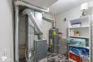 a room with pipes and a heater and a room with at Modern Turnagain Townhome in Anchorage +34 photos