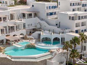 an aerial view of a building with a swimming pool at Mykonos Blu, A Grecotel Resort to Live in Psarou +72 photos