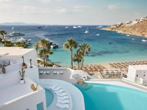 a view of the ocean from the balcony of a resort at Mykonos Blu, a Resort to Live in Psarou