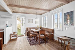 a kitchen and dining room with a table and chairs at SB50621-Sydals-Sonderstrand-6 in Bredsten +14 photos