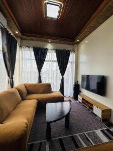 TV a/nebo společenská místnost v ubytování Vcube Residence - 2BR Apt Near Davao International Airport