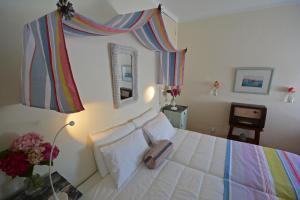 En eller flere senge i et værelse på Casa Maria Obidos