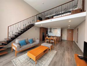 a living room with a couch and a table at Westlake view condominium in Hanoi