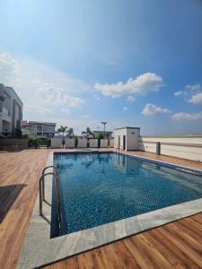 a swimming pool on the roof of a building at Gentle breeze farm house in Venkatāpur