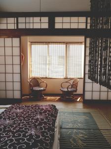 Ένα ή περισσότερα κρεβάτια σε δωμάτιο στο Retro Japanese Home Big Rooftop Fukushima