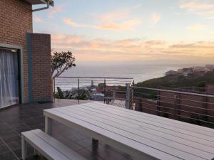 a view of the ocean from the balcony of a house at GriFan Bed & Breakfast in Dana Bay +2 photos