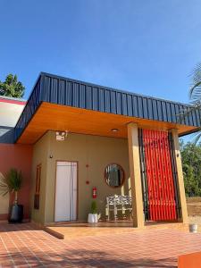 a small house with a red surfboard on it at My Heaven Resort Family House 