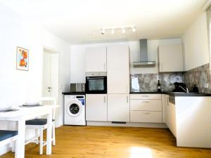 Kuchyň nebo kuchyňský kout v ubytování Appartment am Fuchseck