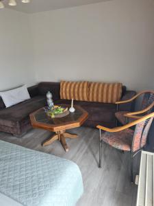 a living room with a couch and a table at Kleine Wohnung 