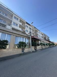 an empty street in front of a building at Hotel Gala in Cluj-Napoca
