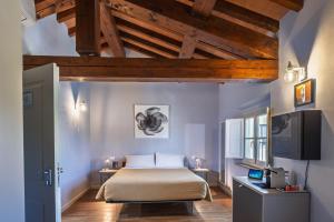 Postel nebo postele na pokoji v ubytování Hotel Cortaccia Sanvitale