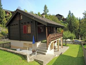 a small house with a porch and a deck at Glacier Views & Ski Trails in Blatten bei Naters
