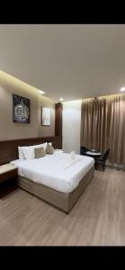 Postel nebo postele na pokoji v ubytování فندق الجابرى