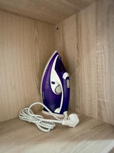 a blue and white phone sitting on a shelf at Kyiv History Apartment in Kyiv