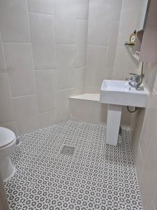 a bathroom with a sink and a toilet at 레토하우스  +21 photos