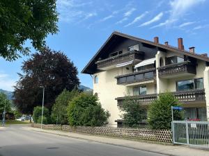 a building with balconies on the side of a street at BergHerz Allgaeu in Sonthofen