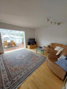a living room with a couch and a rug at Casa Nonna in Klagenfurt +39 photos