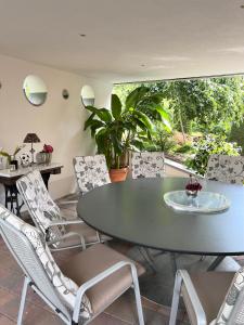 a dining room with a table and chairs at Hundertwasser Hideaway - Villa am Wald bei Bamberg  +38 photos