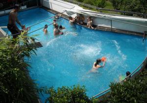 a group of people in a swimming pool at Romantik-Pension Vogt in Offenburg
